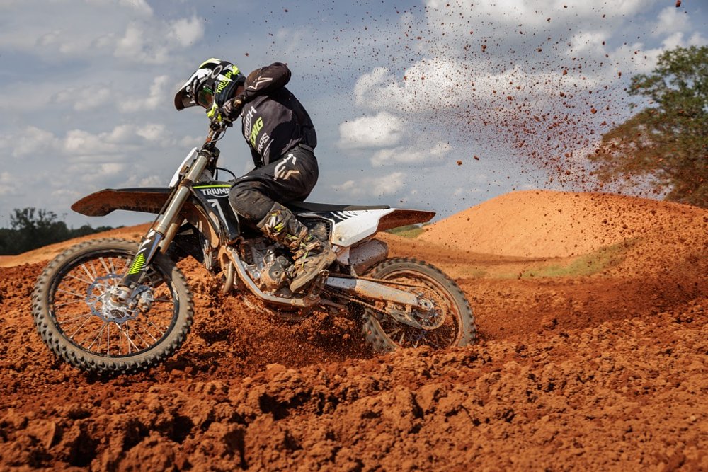 test rider in a turn on the motocross track on the TF 250-X