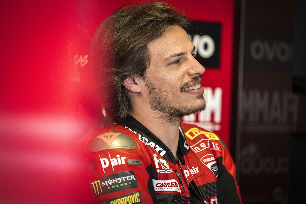 Photo of Bulega smiling in the paddock during testing