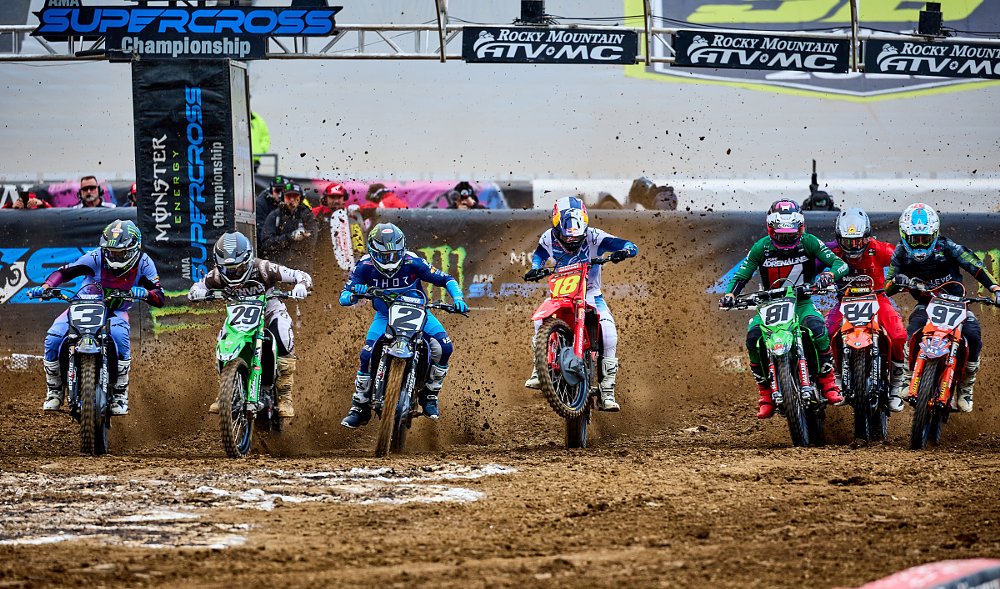 Lawrence and other riders accelerating from the gate at the start of a heat race in Philadelphia