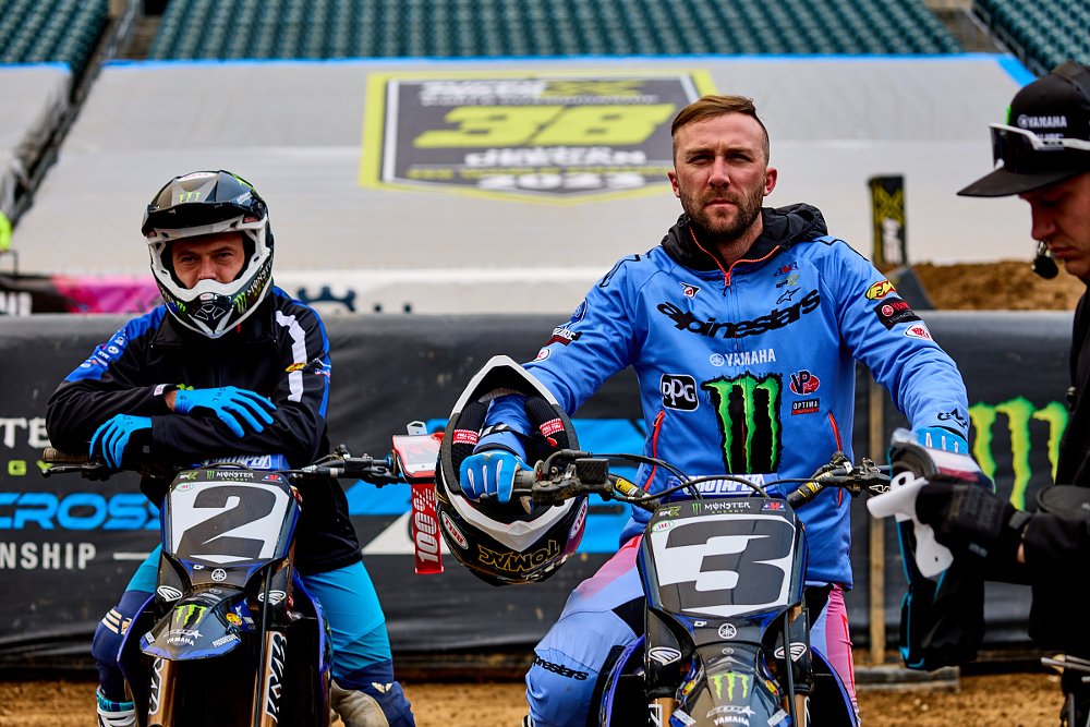 Cooper Webb and Eli Tomac getting ready for a race, sitting at the starting gate