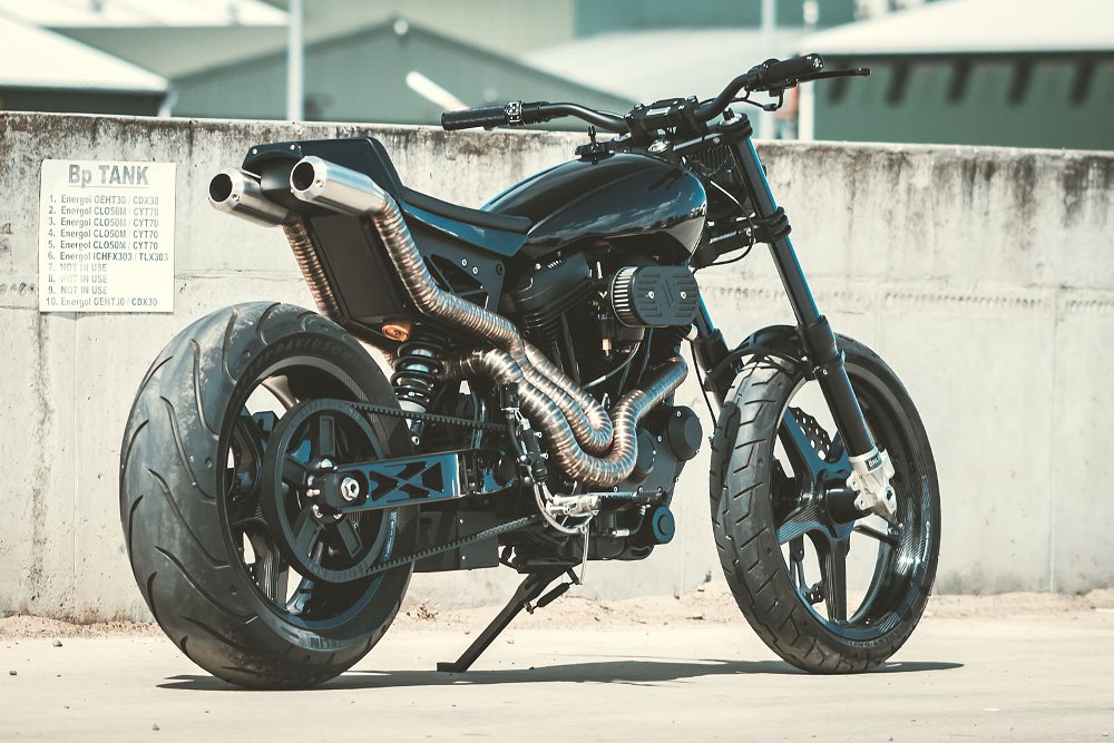 rear quarter view showing sectioned exhaust pipes