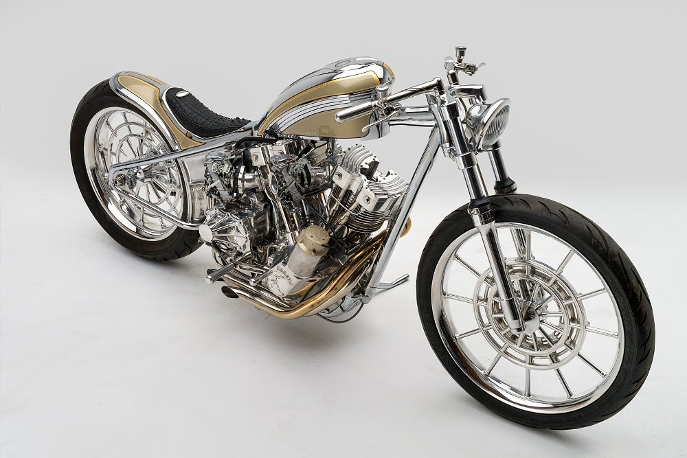overhead view of the minimalist, gold-colored V-twin custom motorcycle