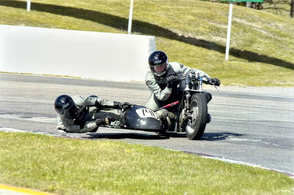 A vintage racing sidecar navigating Turn 10 at Canadian Tire Motorsport Park, aka Mosport.
