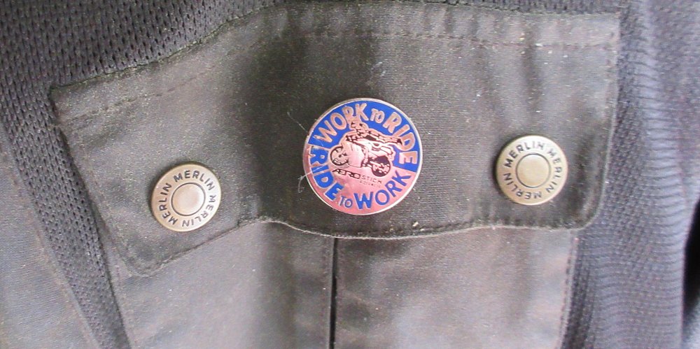 RTW logo pin on the pocket of a Merlin jacket