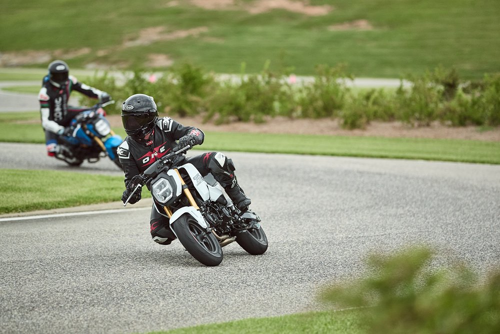 two racing Groms one after the other on the track