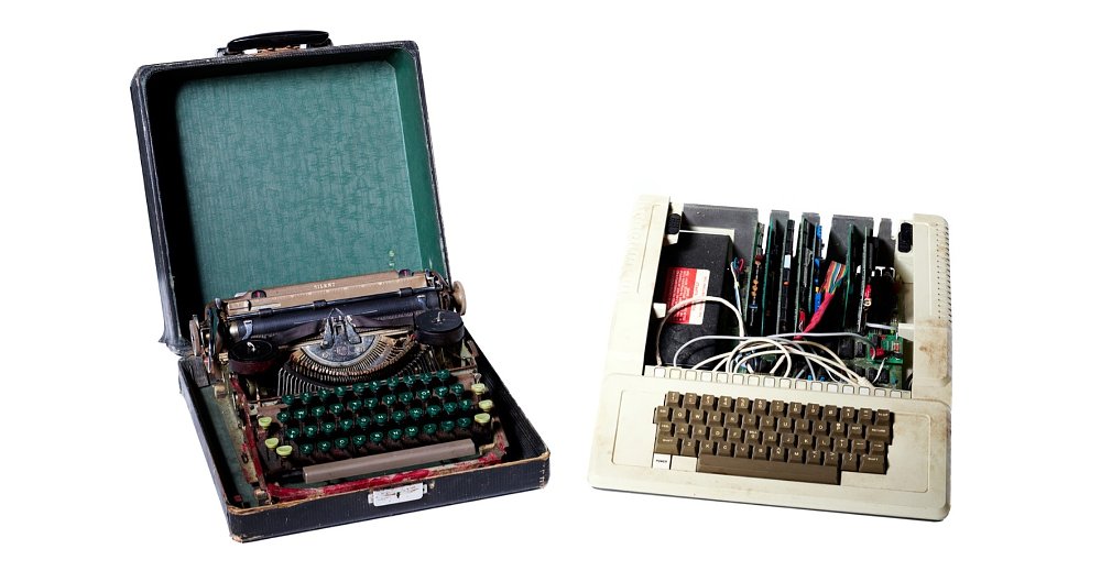 studio photo of the typewriter and the Apple computer