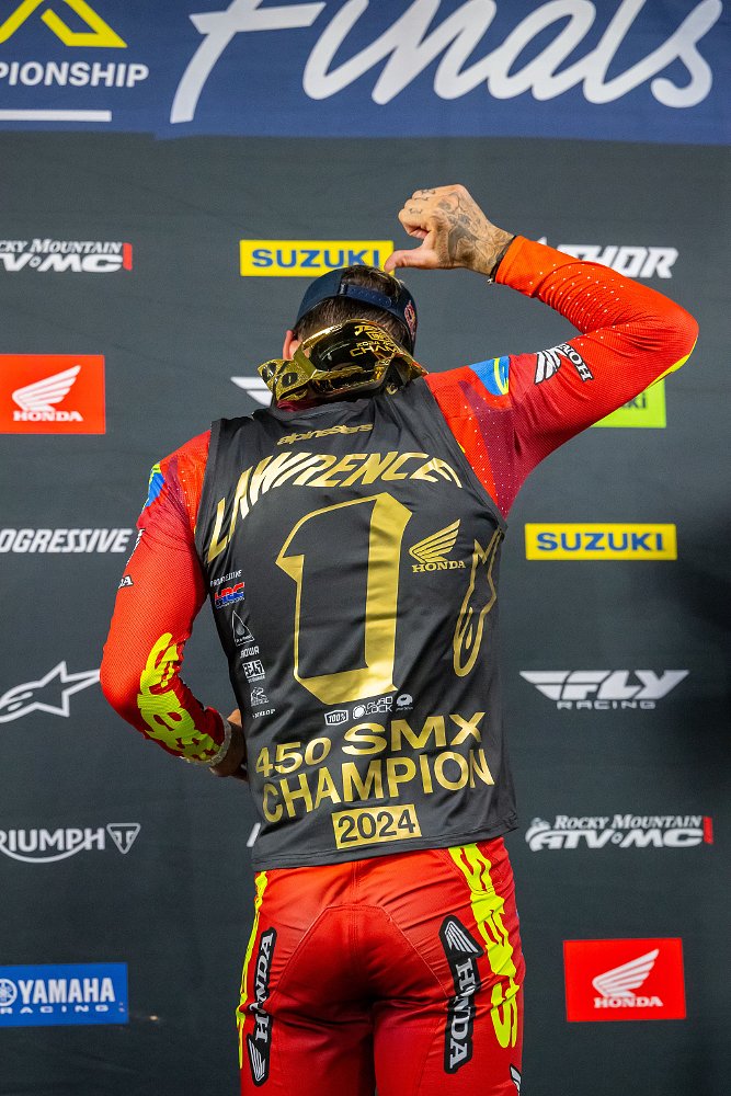 Jett Lawrence points to the number one on his shirt, which has a last name only, in his post-race celebration