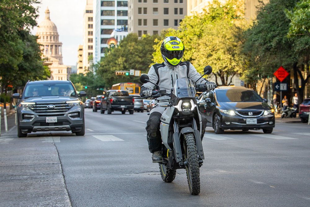 Origin on a city street with the state house in the background