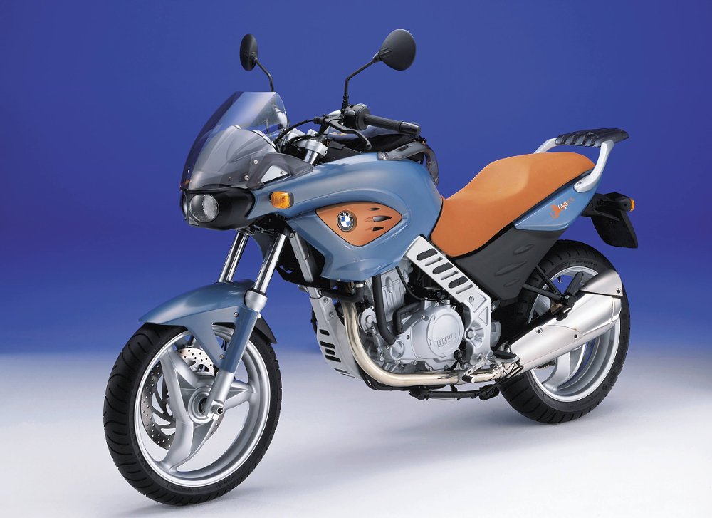 studio photo of a BMW F 650 CS in light blue with an orange seat