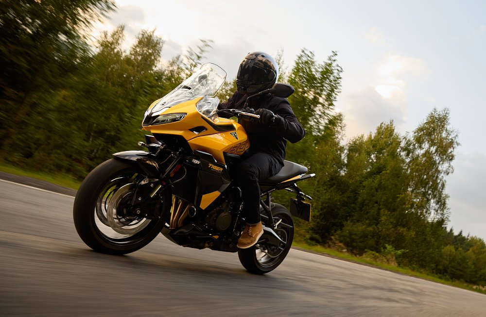 single rider on a yellow Tiger Sport 800 on the road