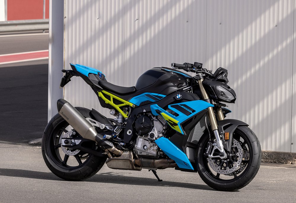 blue and black S 1000 R with a yellow frame parked at the track