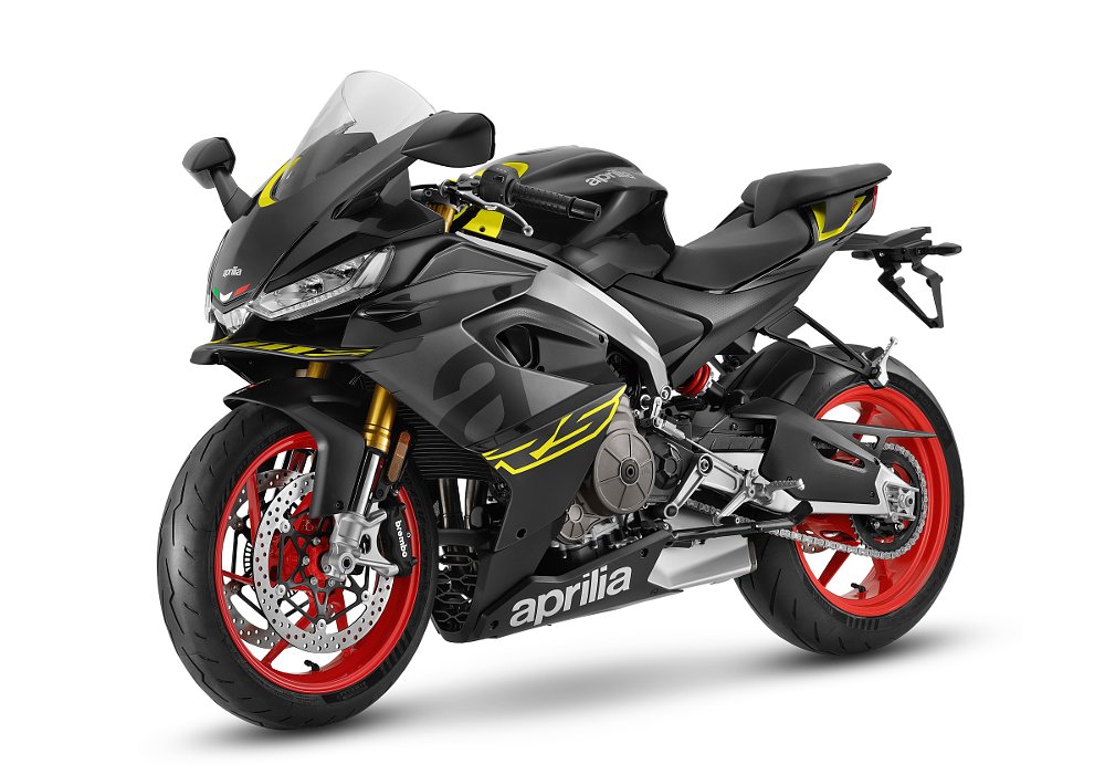 black and yellow Aprilia RS 660 sport motorcycle in a studio photo