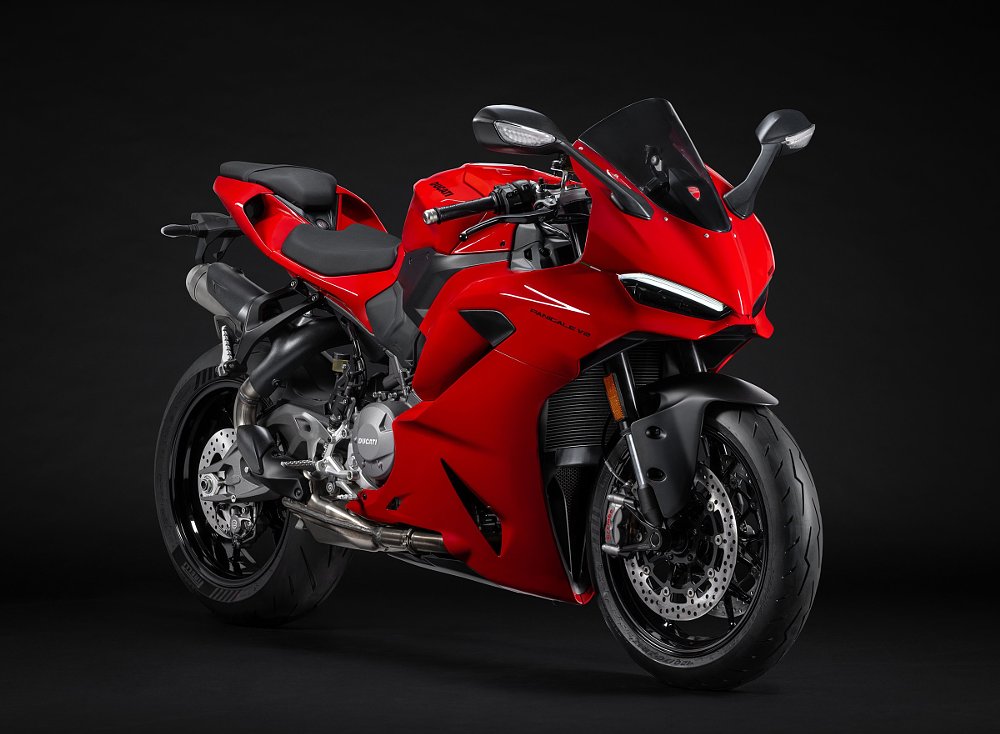 studio photo of red Ducati Panigale V2 sport motorcycle
