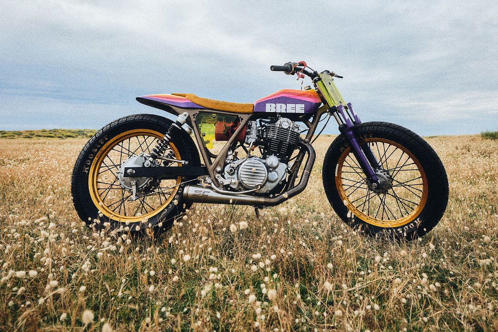 yellow custom SR400 parked in a field