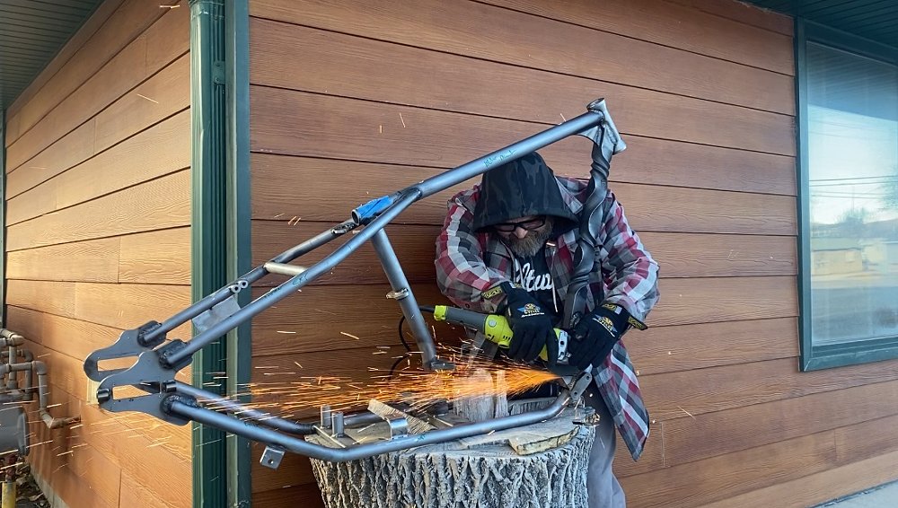 Patrick welding a motorcycle frame