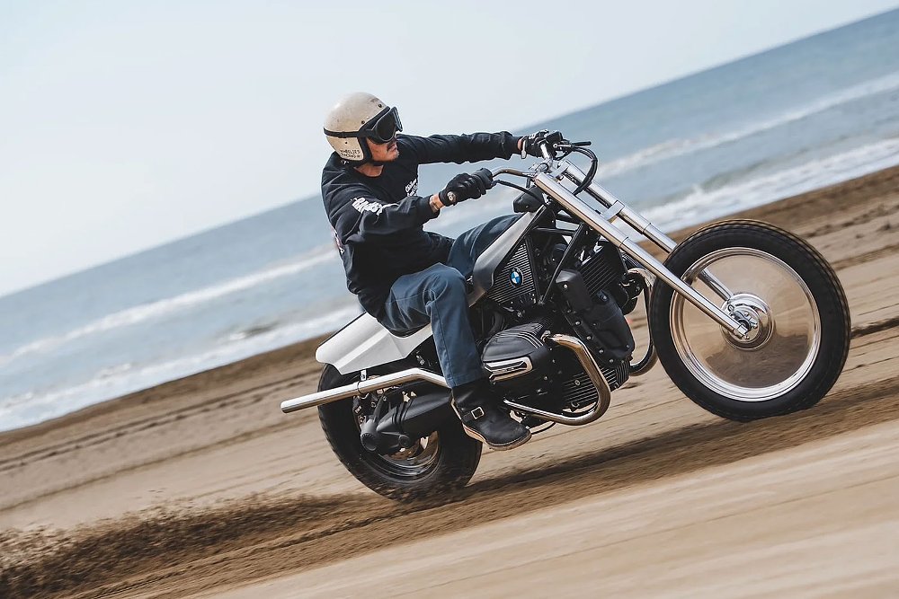 rider racing the custom R 12 on the beach