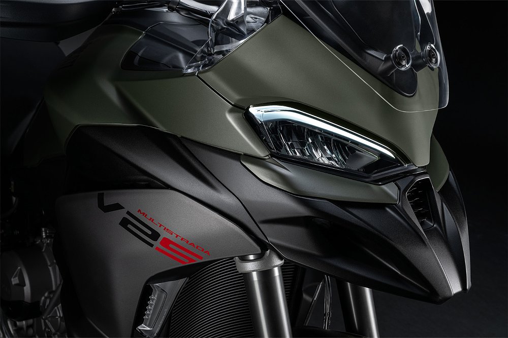 A close up of the 2025 Ducati Multistrada V2's headlight cluster and front beak.