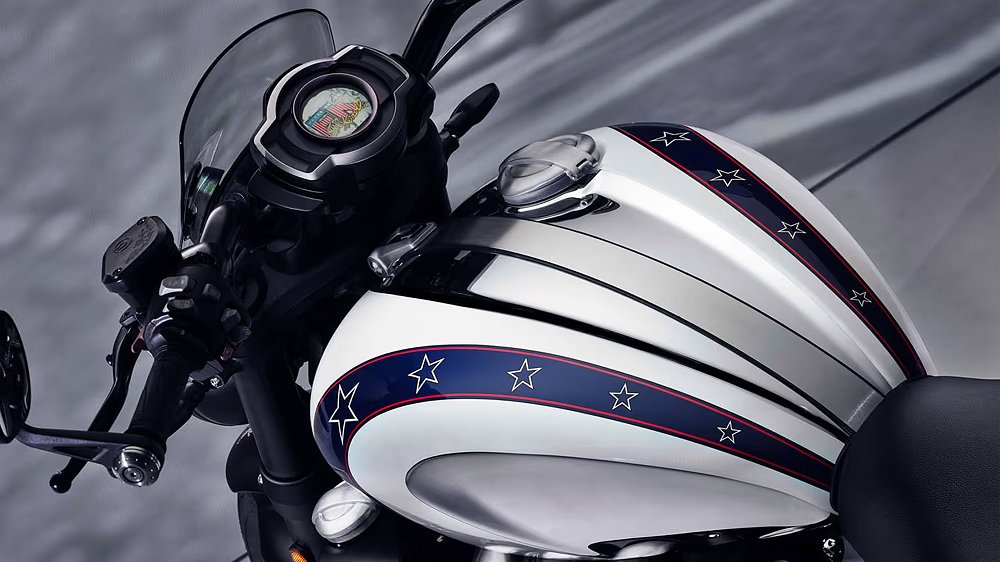 A close up of the Triumph Rocket 3's cockpit with its gas tank bearing Evel Knievel graphics.