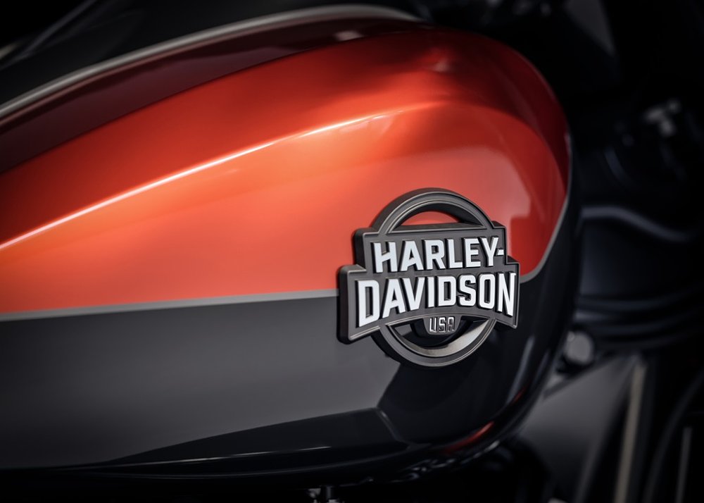 black Harley-Davidson emblem on red-and-black tank