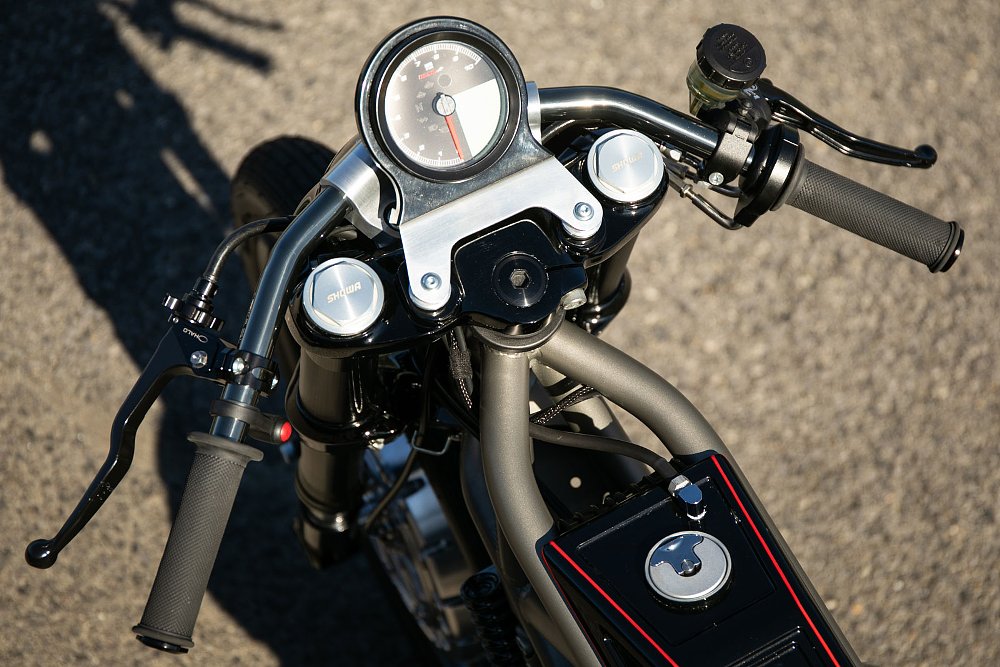 view of the single gauge from the rider's perspective and tiny fuel tank