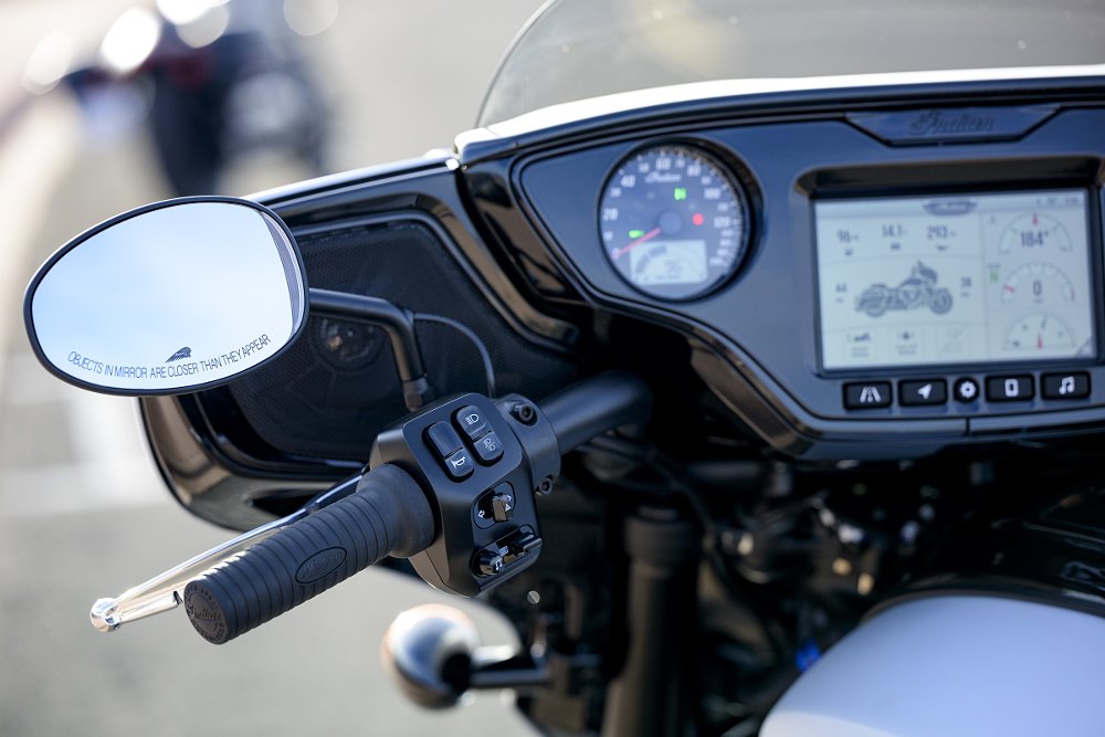 close view of left rearview mirror and digital display