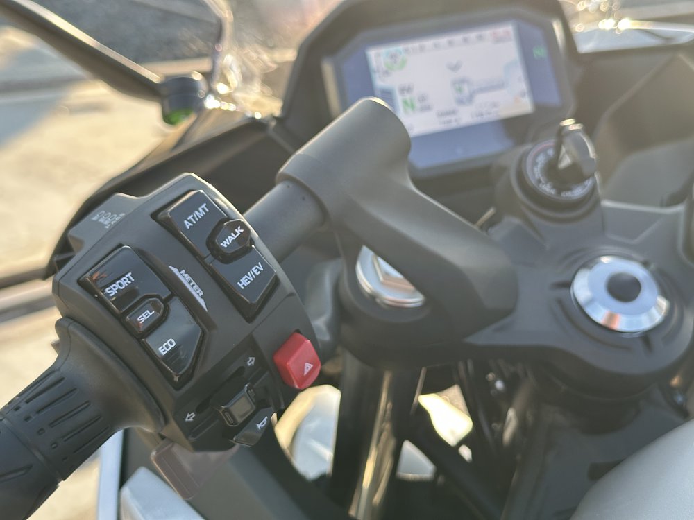 2025 Kawasaki Ninja 7 Hybrid left handlebar control detail.