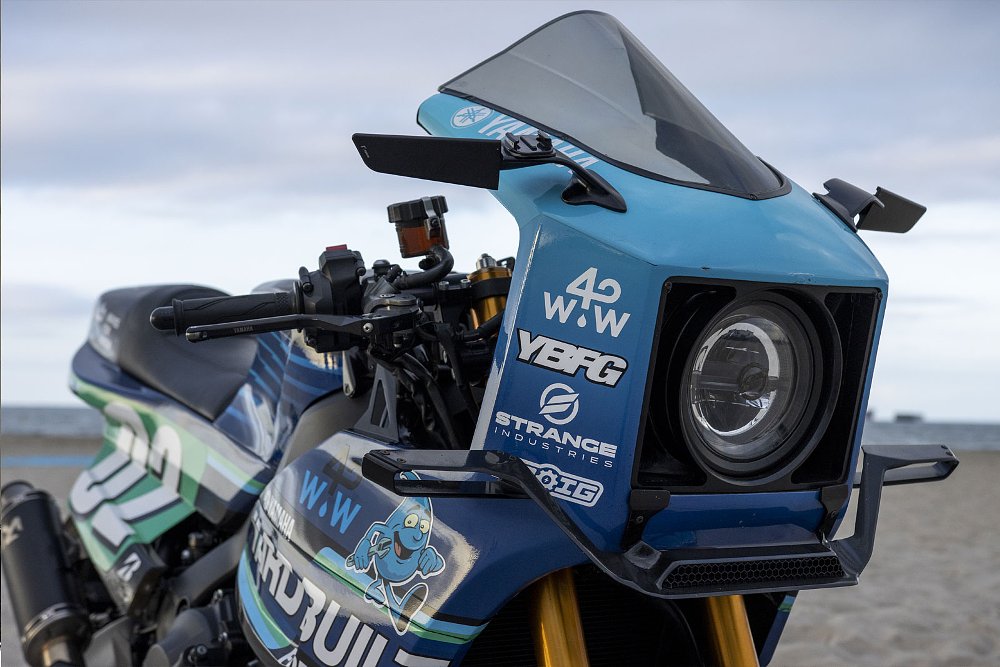 close view of front headlight cowl on the blue custom
