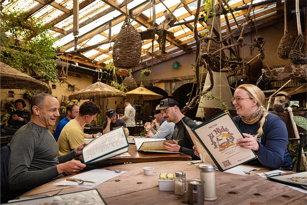 A group of riders gather for lunch on the patio of a Mexican restaurant.