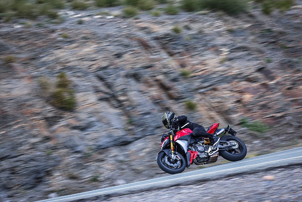 Dustin speeding down a mountain road aboard the Streetfighter V2 S.