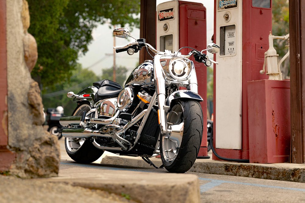 The Fat Boy Gray Ghost staged next to a pair of old gas pumps.