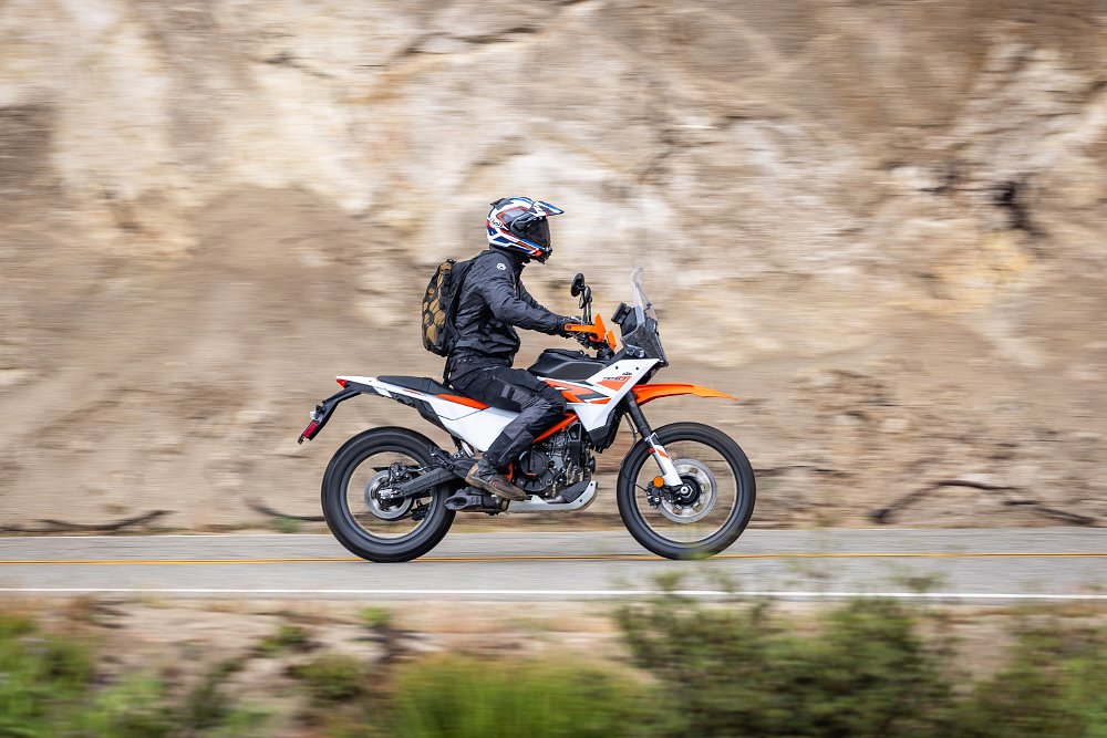 2025 KTM 390 Adventure R riding in profile, showing the rider triangle.