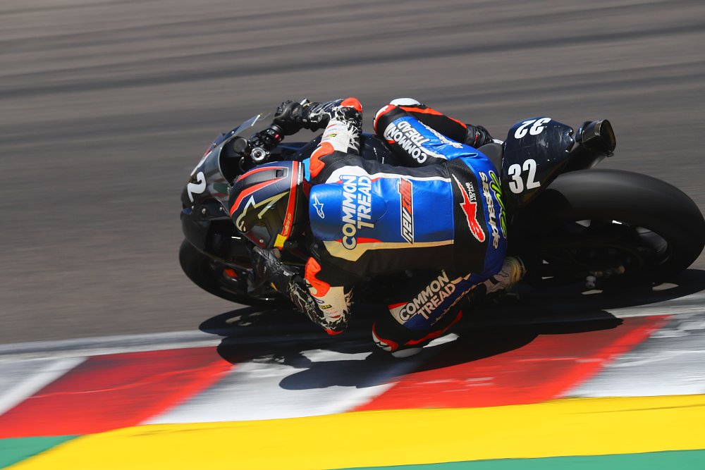 BMW S 1000 RR riding through Rainey Curve at Laguna Seca Raceway.