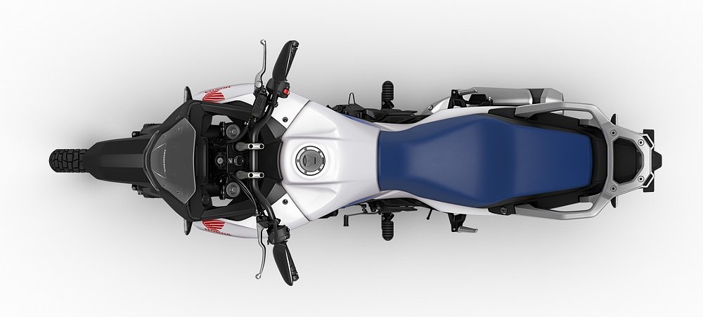 studio photo showing view of the Transalp from overhead, with a seat a little broader than the norm in off-road motorcycles