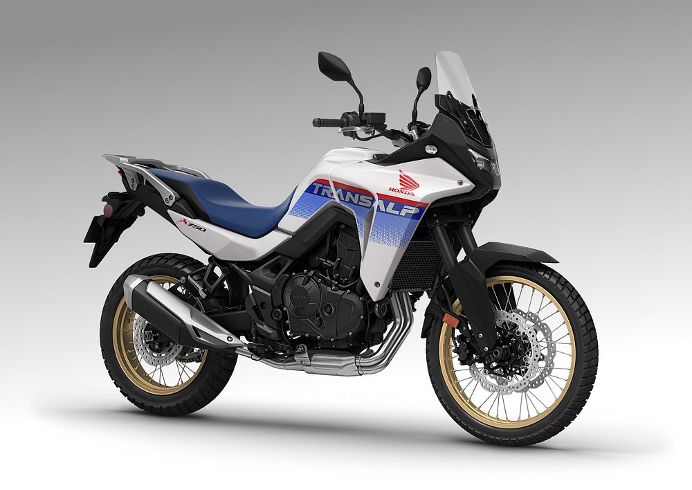 studio photo of 2025 Honda Transalp in white with red and blue accents