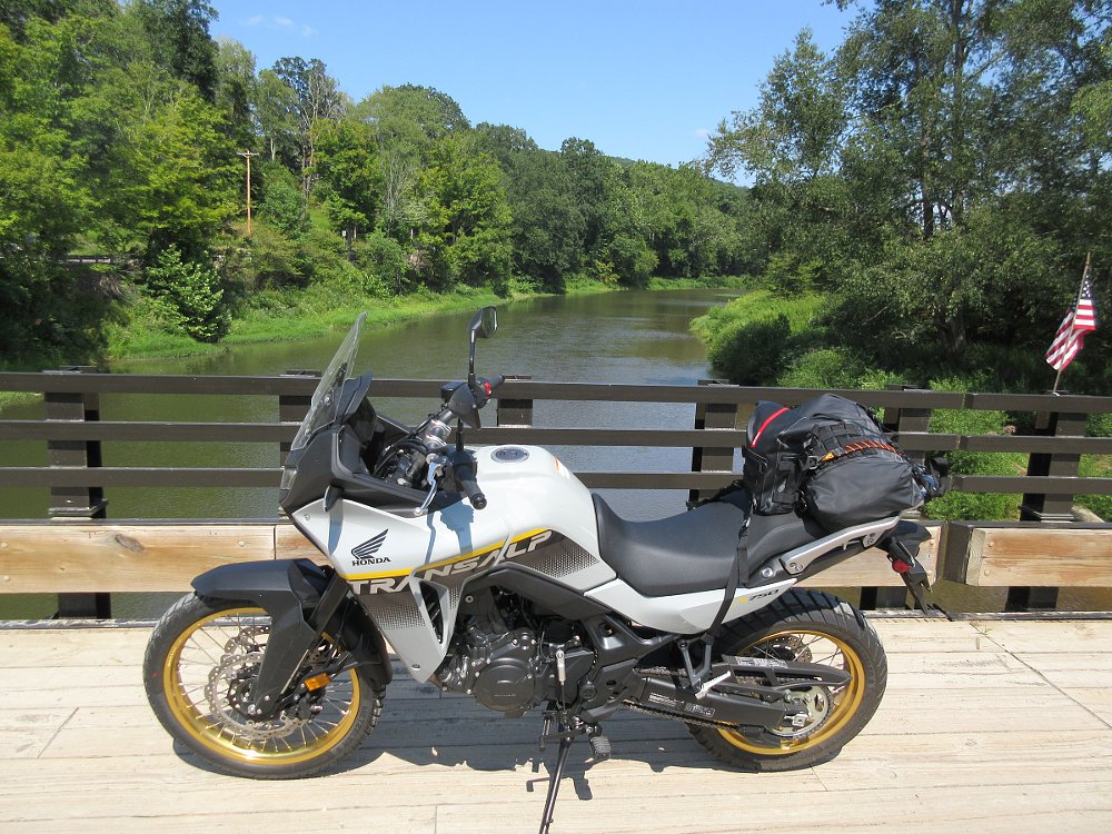 Transalp with soft luggage attached, parked on a bridge overlooking Tionesta Creek in Pennsylvania