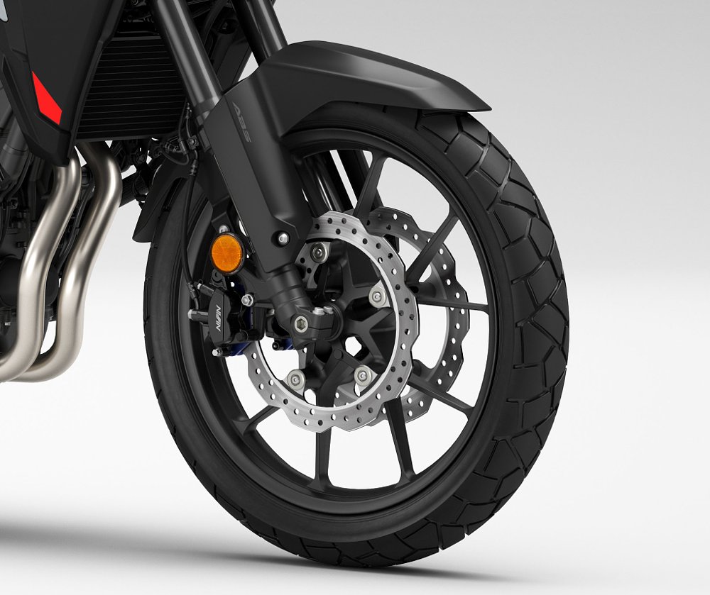 studio photo close view of the front wheel, brakes, and suspension