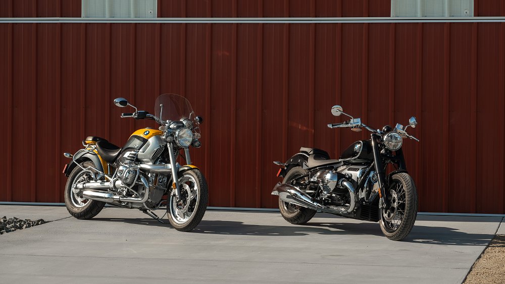 BMW's R 1200 C cruiser in yellow, parked next to the R 18 cruiser.