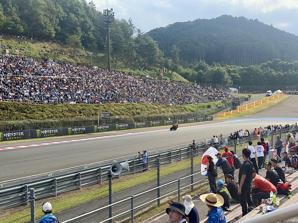 view from the grandstands at Motegi as Bagnaia sweeps into a curve
