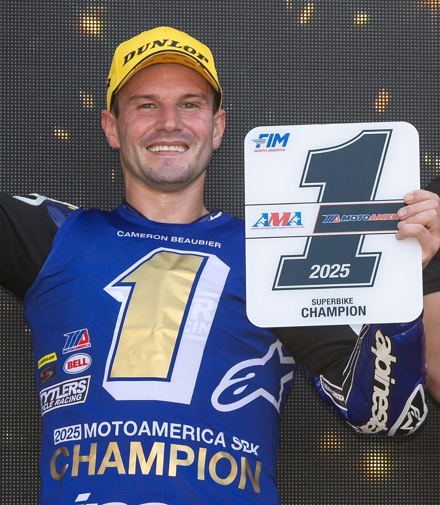 smiling Cameron Beaubier holding his AMA #1 plate