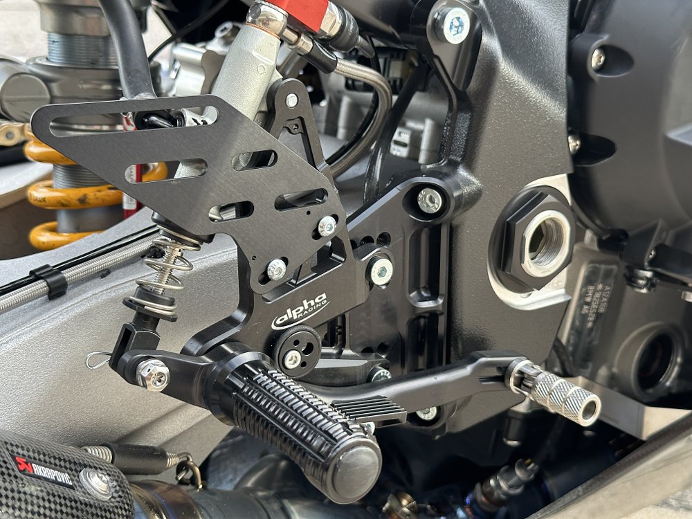 2025 alpha Racing M 1000 RR rearset footpeg detail.