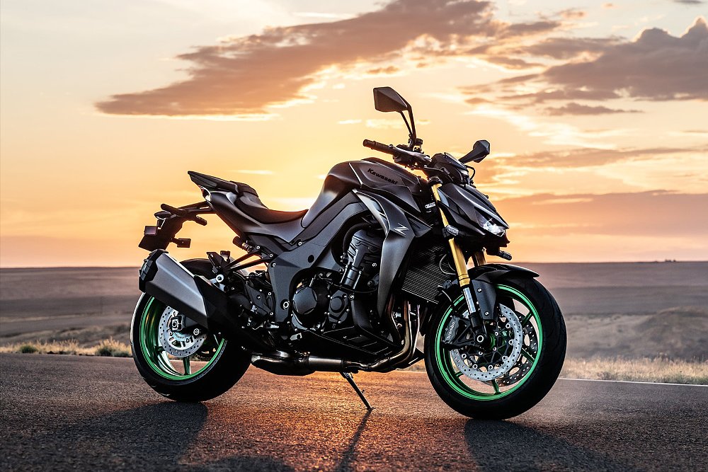 The Kawasaki Z1100 SE pictured with a sunset in the background.