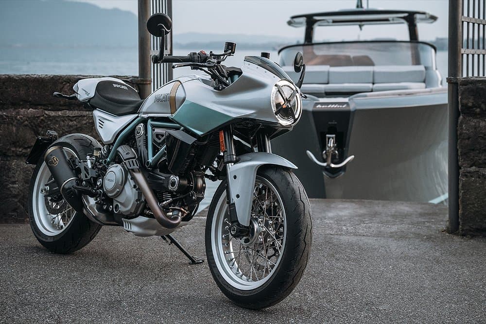 The Formula 73 parked dockside with a boat in the background.