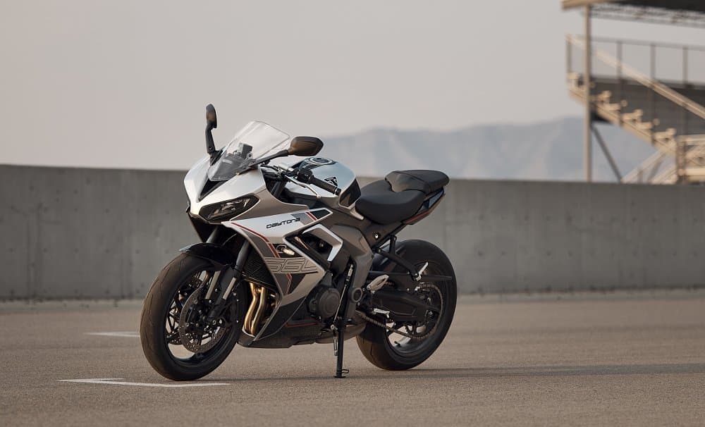 Triumph Daytona 660 in silver, parked at the track