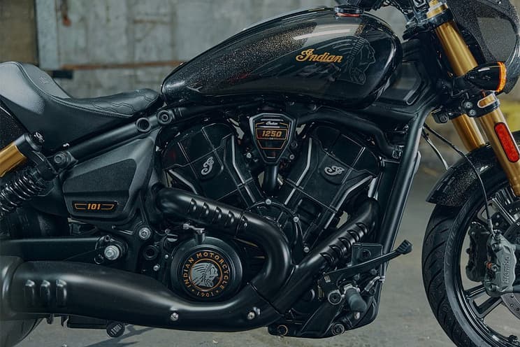 A close-up of the Sport Scout's black metal-flake painted tank and V-twin engine.